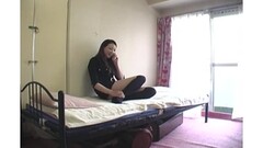 Japanese girl sits on bed and rubs pussy through panties Thumb