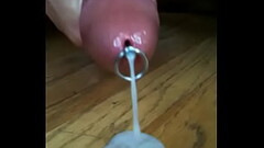 Chris X masturbates his cock with a flow thru urethral insert and spits a huge load Thumb